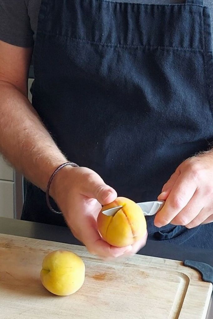 Cutting peach horizontal to remove pit
