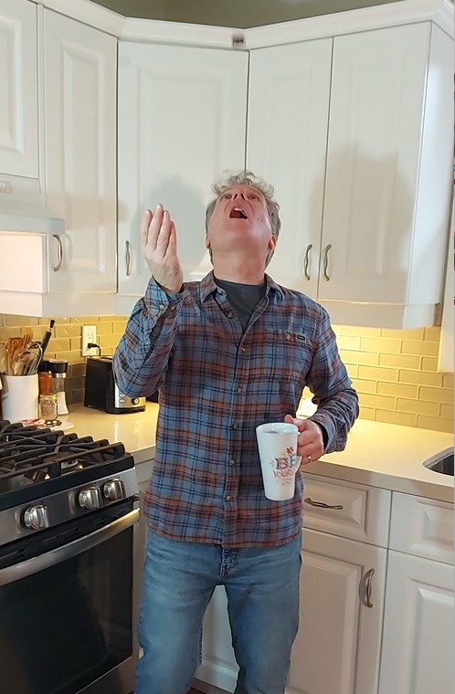 Tossing fudgy snowball in air and trying to catch in mouth